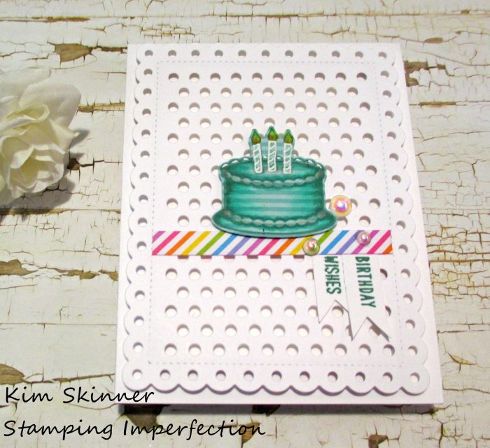 Stamping on patterned paper and adding marker details